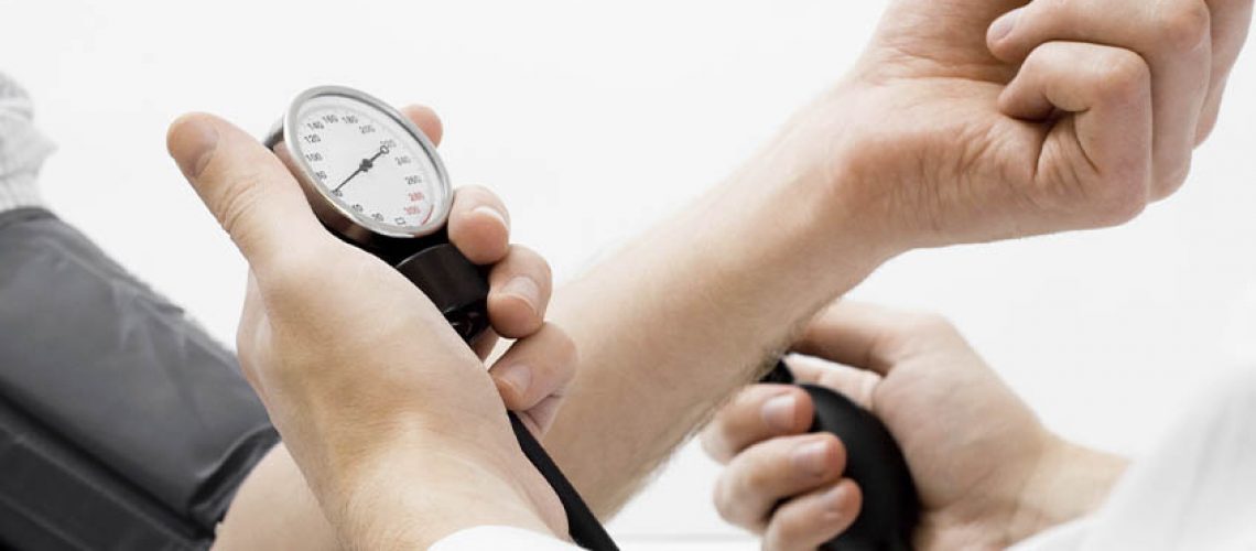 doctor taking patient's pulse
